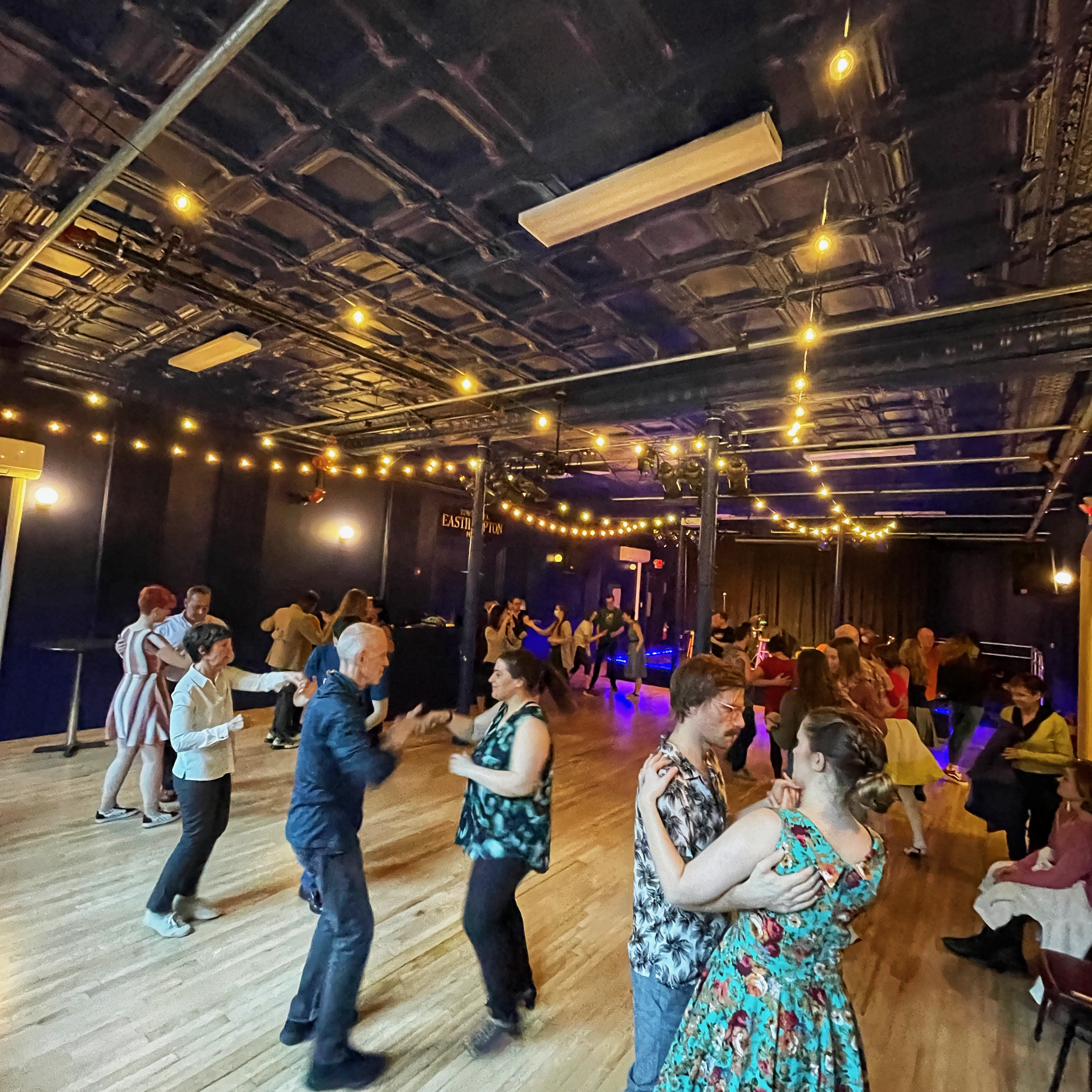 Swing Dancers in a Blue Room