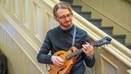 person playing mandolin