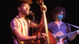 performer playing the upright bass and singing